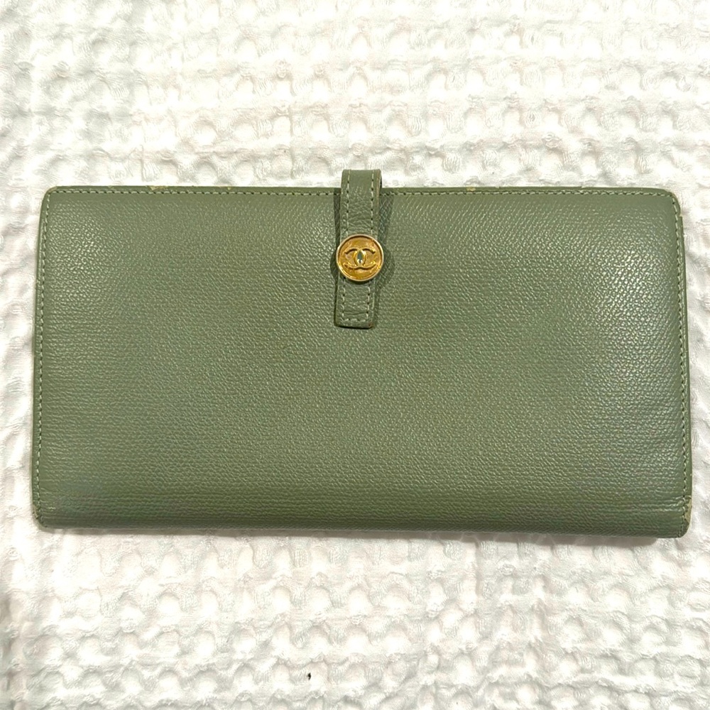 Sage green Chanel wallet in great condition with minor wear on the corners.